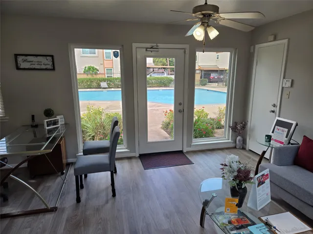 a living room with furniture and a large window