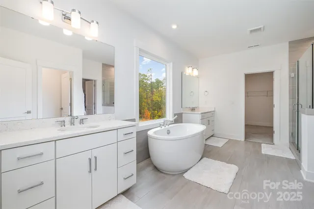 a bathroom with a shower and a glass door