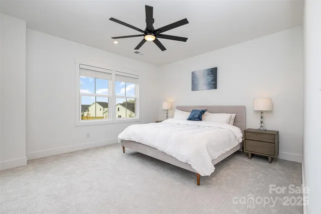a bathroom with a sink toilet vanity and shower
