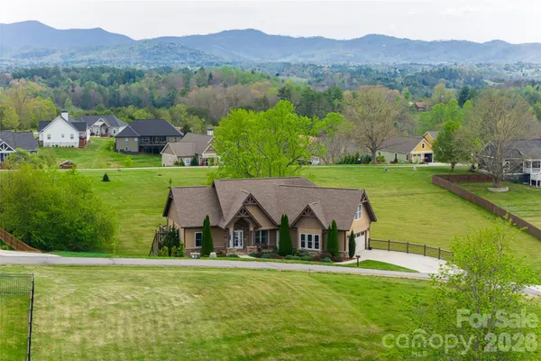 an aerial view of a house with a garden