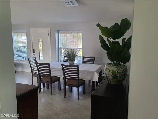 a view of a backyard with a sitting area