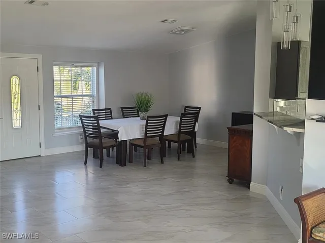 a white bath tub sitting next to a white sink