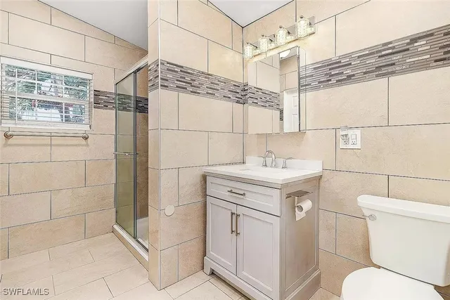 a front view of a house with a yard and a garage