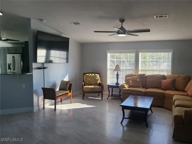 a living room with furniture and a window