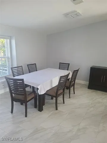 a view of a dining room with furniture