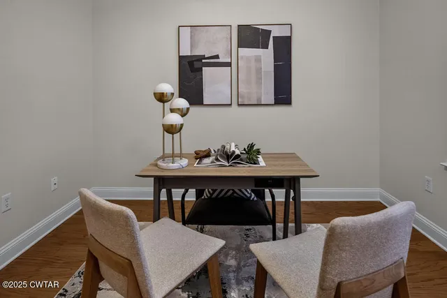 a view of a workspace with furniture