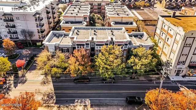 an aerial view of a multi story parking building