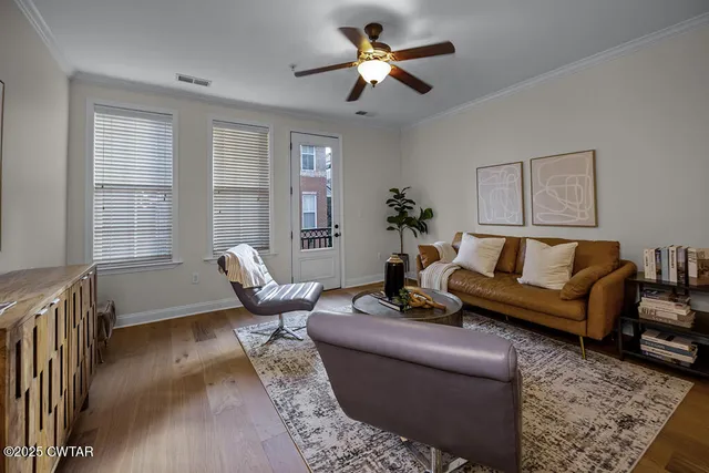 a living room with furniture and windows