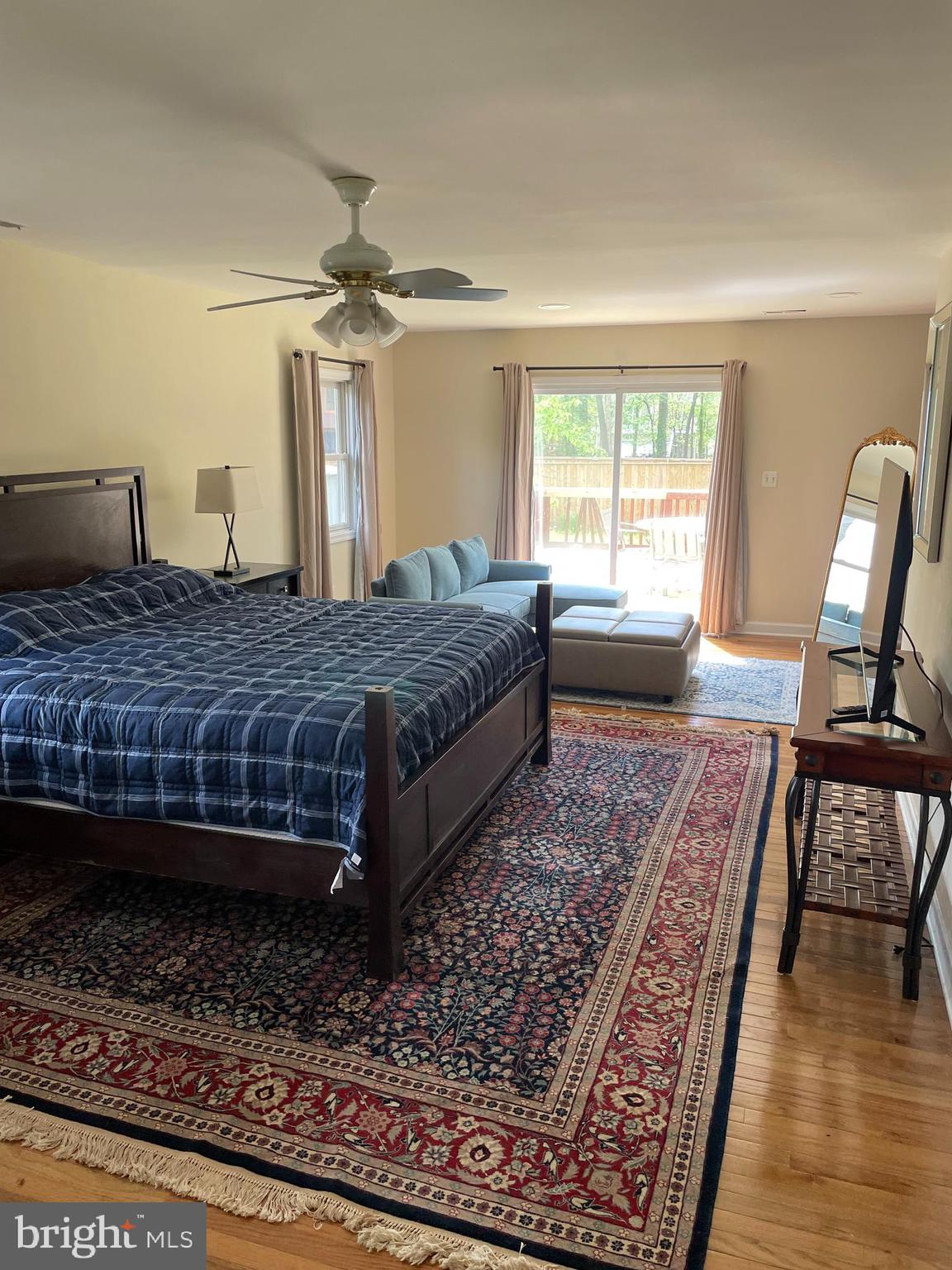 3460 Cohasset Avenue Annapolis, MD 21403 - Photo 14 of 29 a bedroom with a large bed and wooden floor