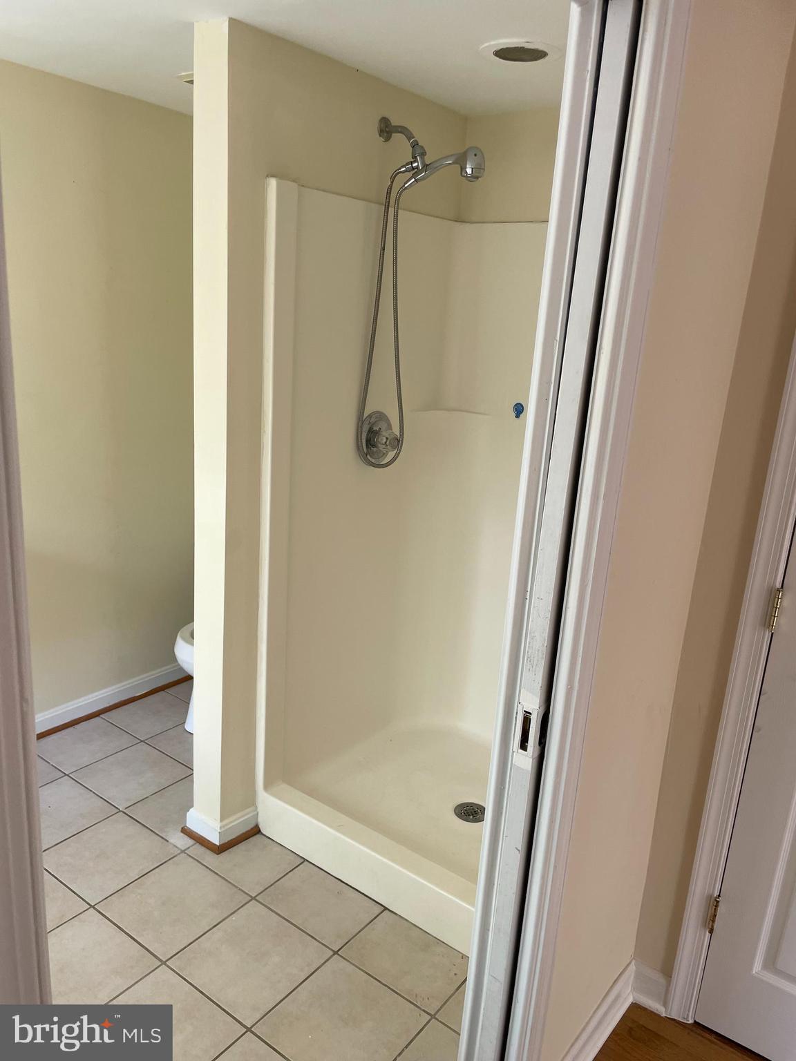 3460 Cohasset Avenue Annapolis, MD 21403 - Photo 23 of 29 a bathroom with a glass shower door