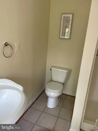 a bathroom with a toilet and a sink