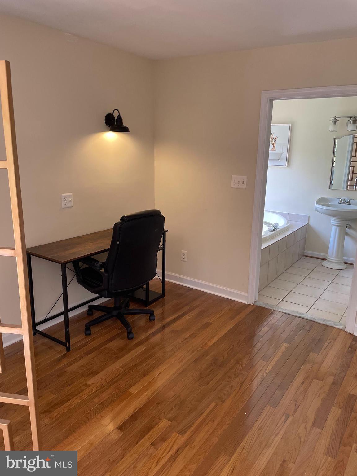 3460 Cohasset Avenue Annapolis, MD 21403 - Photo 28 of 29 a view of a workspace room with wooden floor and windows