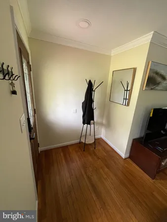 a view of an entryway with wooden floor