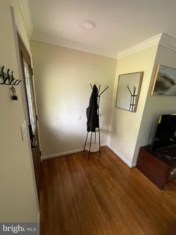 a view of an entryway with wooden floor