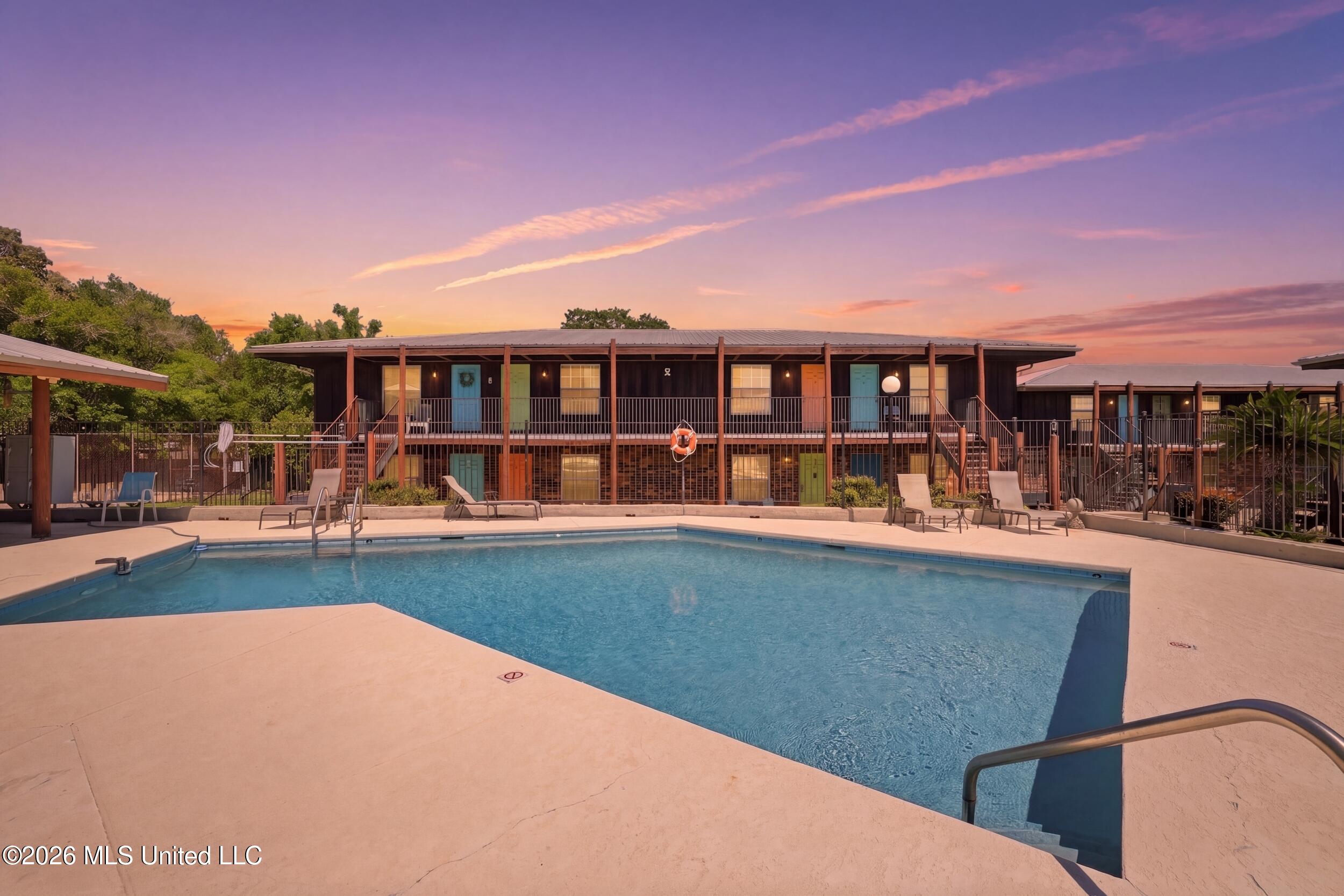 1550 East 2nd Street, Unit R105 Pass Christian, MS 39571 - Photo 2 of 36 1_r6__4908_twilight_b3dd51fe