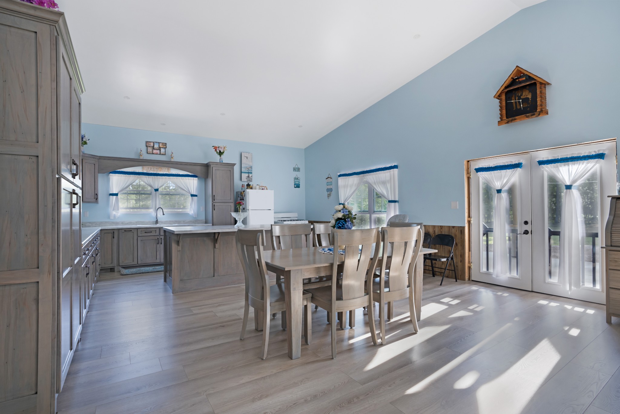 1779 Mt Zion Road Big Sandy, TN 38221 - Photo 13 of 31 a view of a dining room with furniture and wooden floor
