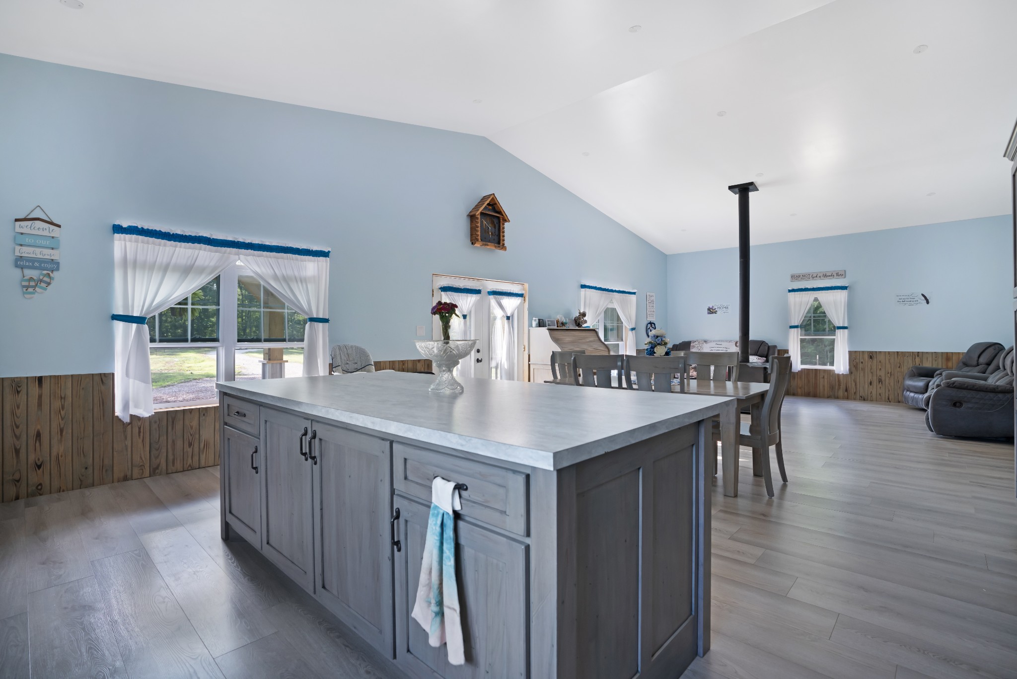 1779 Mt Zion Road Big Sandy, TN 38221 - Photo 16 of 31 a kitchen with kitchen island a sink appliances and a dining table view