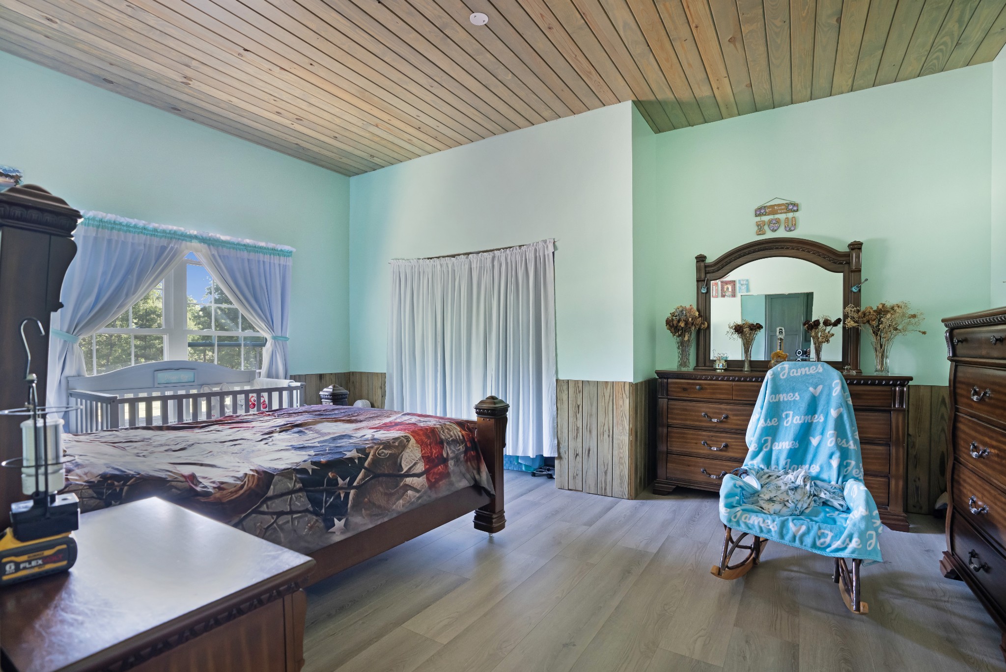 1779 Mt Zion Road Big Sandy, TN 38221 - Photo 17 of 31 a bedroom with furniture and a window