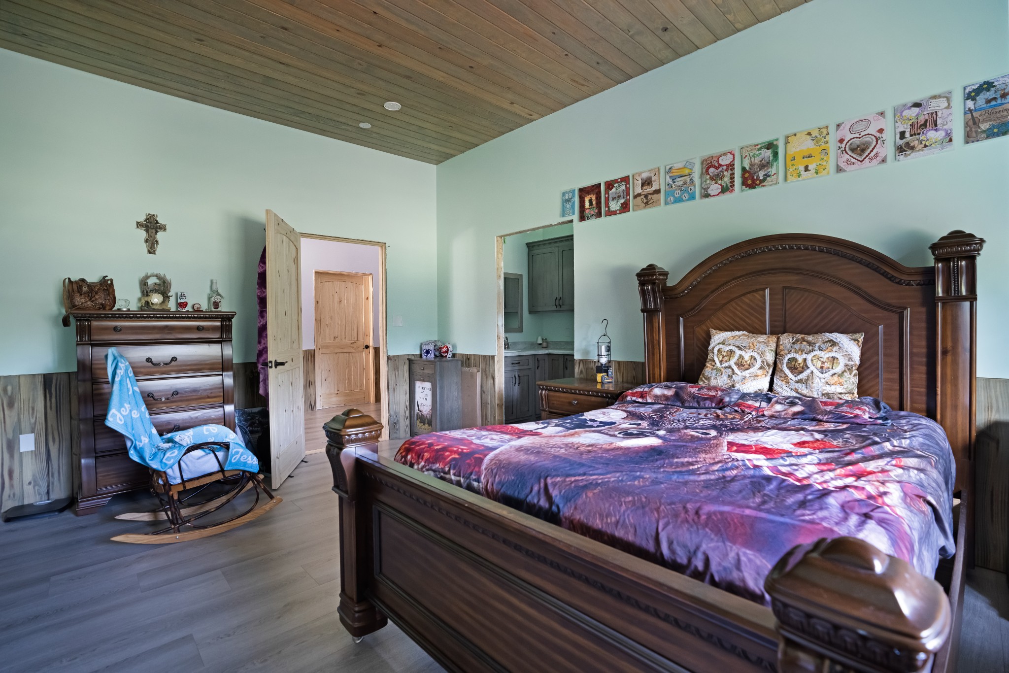 1779 Mt Zion Road Big Sandy, TN 38221 - Photo 18 of 31 a bedroom with a bed and wooden floor