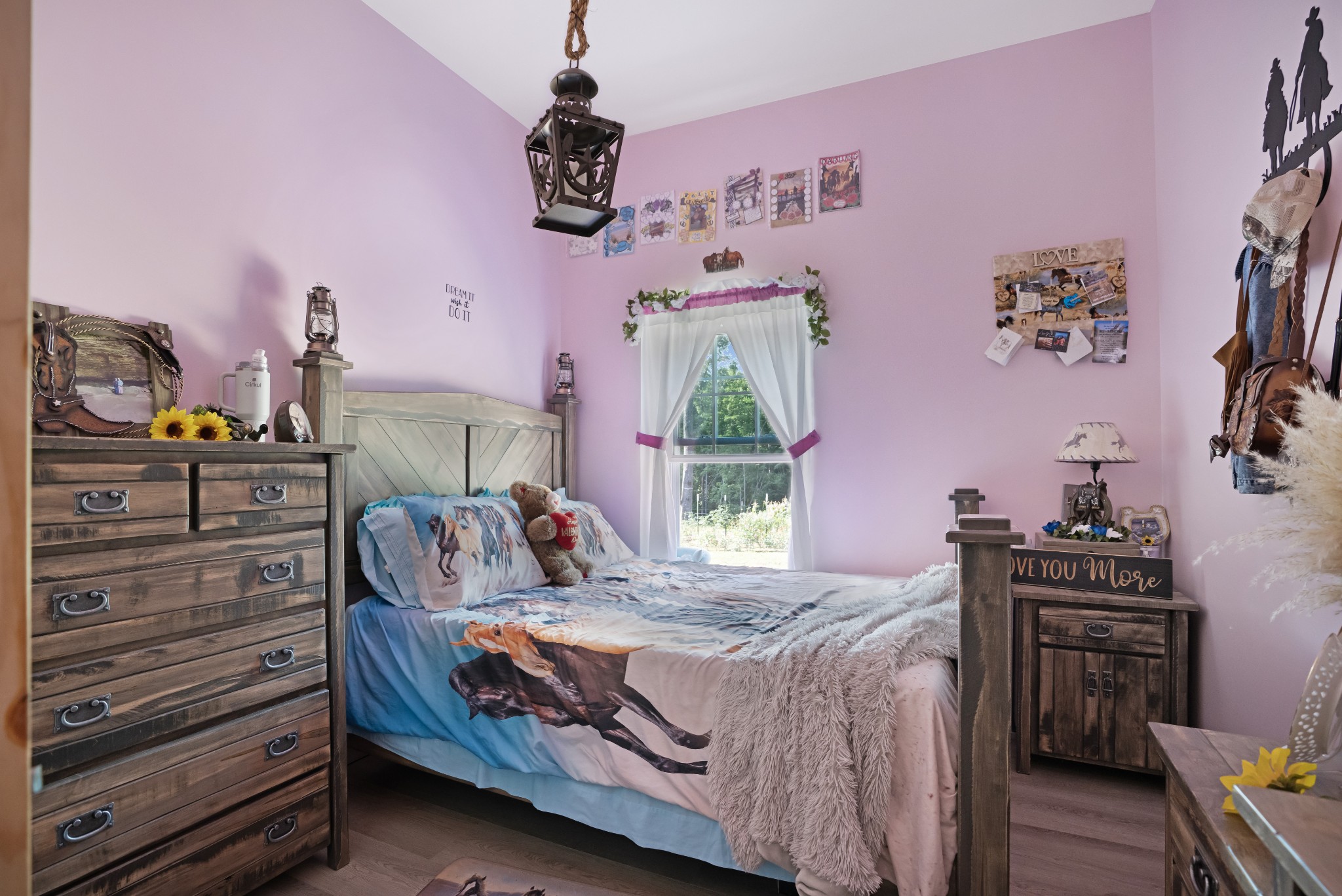 1779 Mt Zion Road Big Sandy, TN 38221 - Photo 22 of 31 a bedroom with a bed and a dresser in it