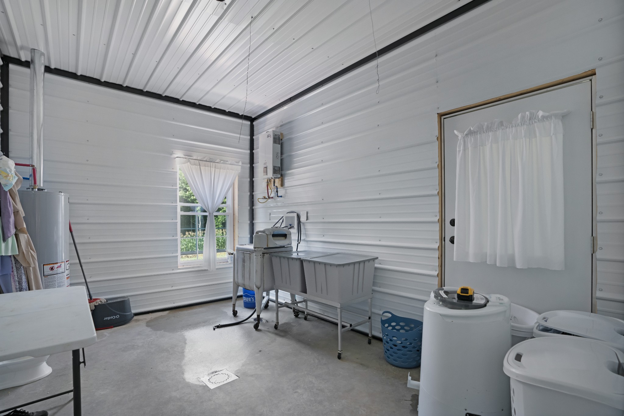 1779 Mt Zion Road Big Sandy, TN 38221 - Photo 24 of 31 a room with a chair and white walls