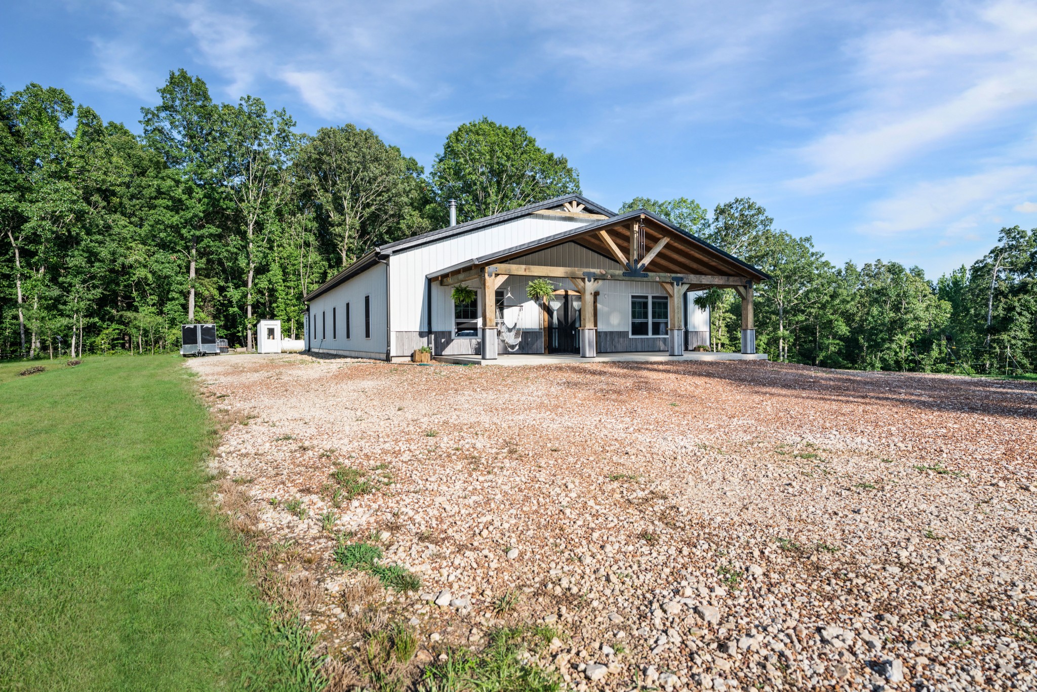 1779 Mt Zion Road Big Sandy, TN 38221 - Photo 4 of 31 a front view of a house with a garden