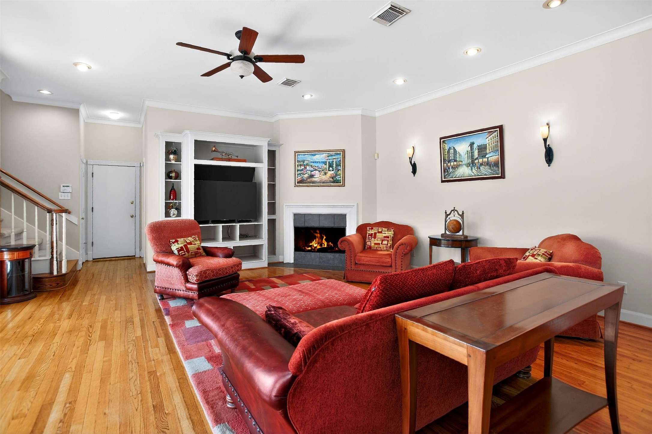 3118 Virginia Street Houston, TX 77098 - Photo 13 of 50 Spacious living area with gas log fireplace and gorgeous hardwood floors.
