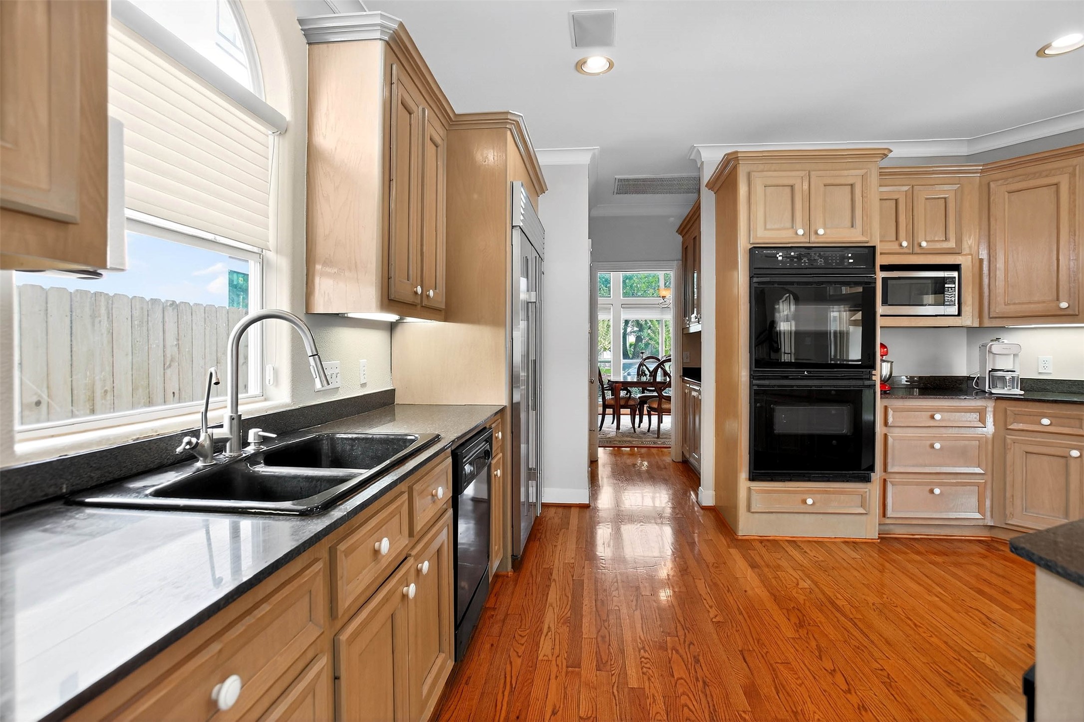 3118 Virginia Street Houston, TX 77098 - Photo 18 of 50 Plenty of storage and an attached walk-in pantry make this kitchen a functional and organized space for all your culinary needs.