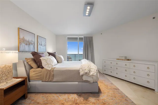 a bedroom with a bed and a cabinets