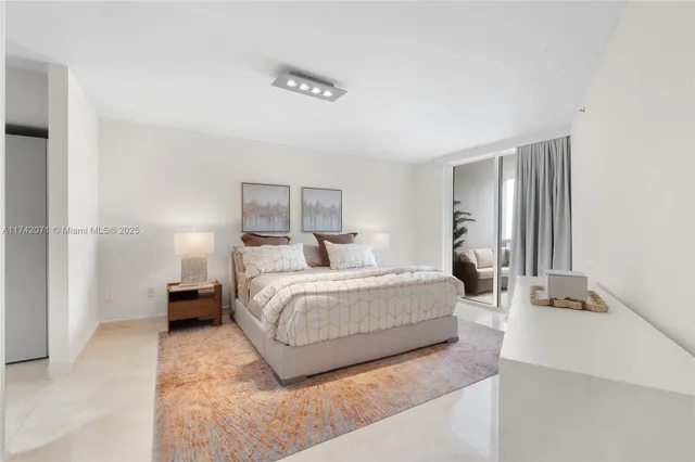 a living room with furniture a couch and a chandelier