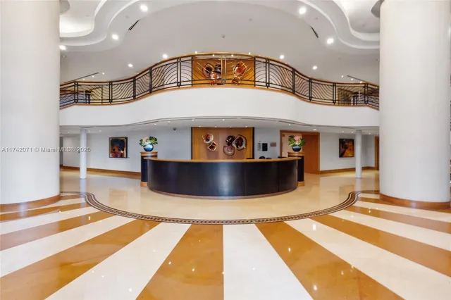 a kitchen with stainless steel appliances granite countertop white cabinets and sink