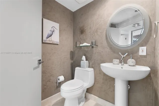 a view of a kitchen with a sink and a window