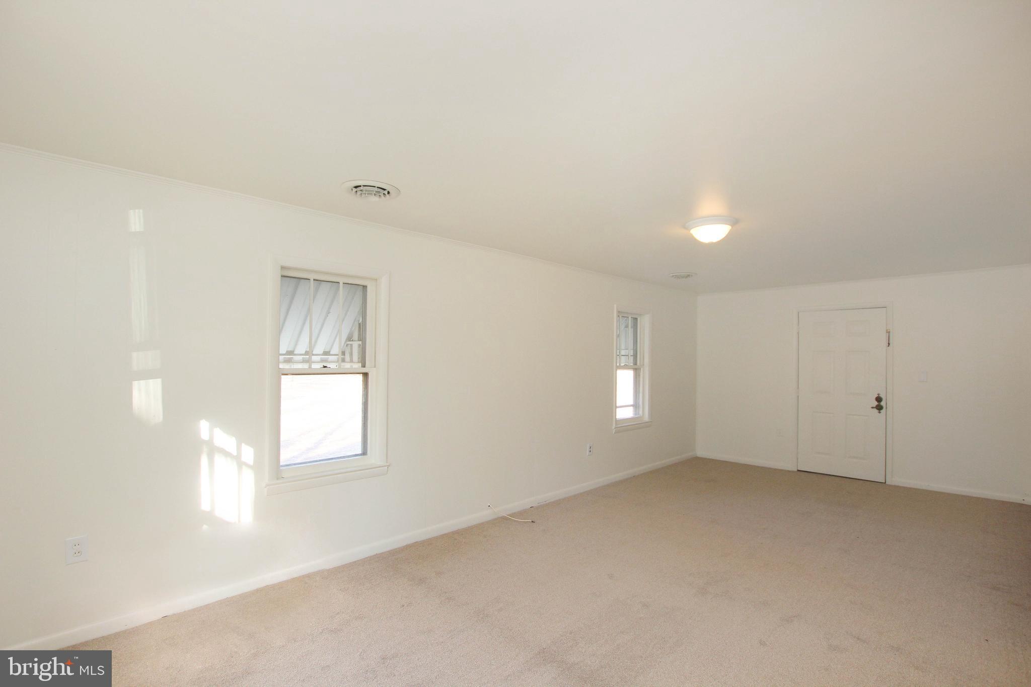 5807 Eldorado Sharptown Road Rhodesdale, MD 21659 - Photo 10 of 24 Living Room and front door