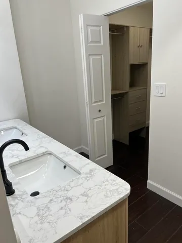 a bathroom with a sink and a mirror