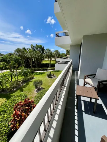 a view of balcony and yard