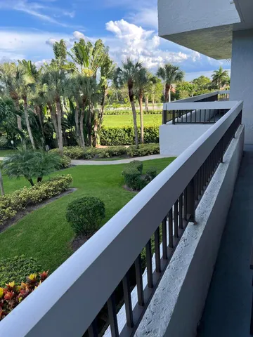 a view of a garden from a balcony