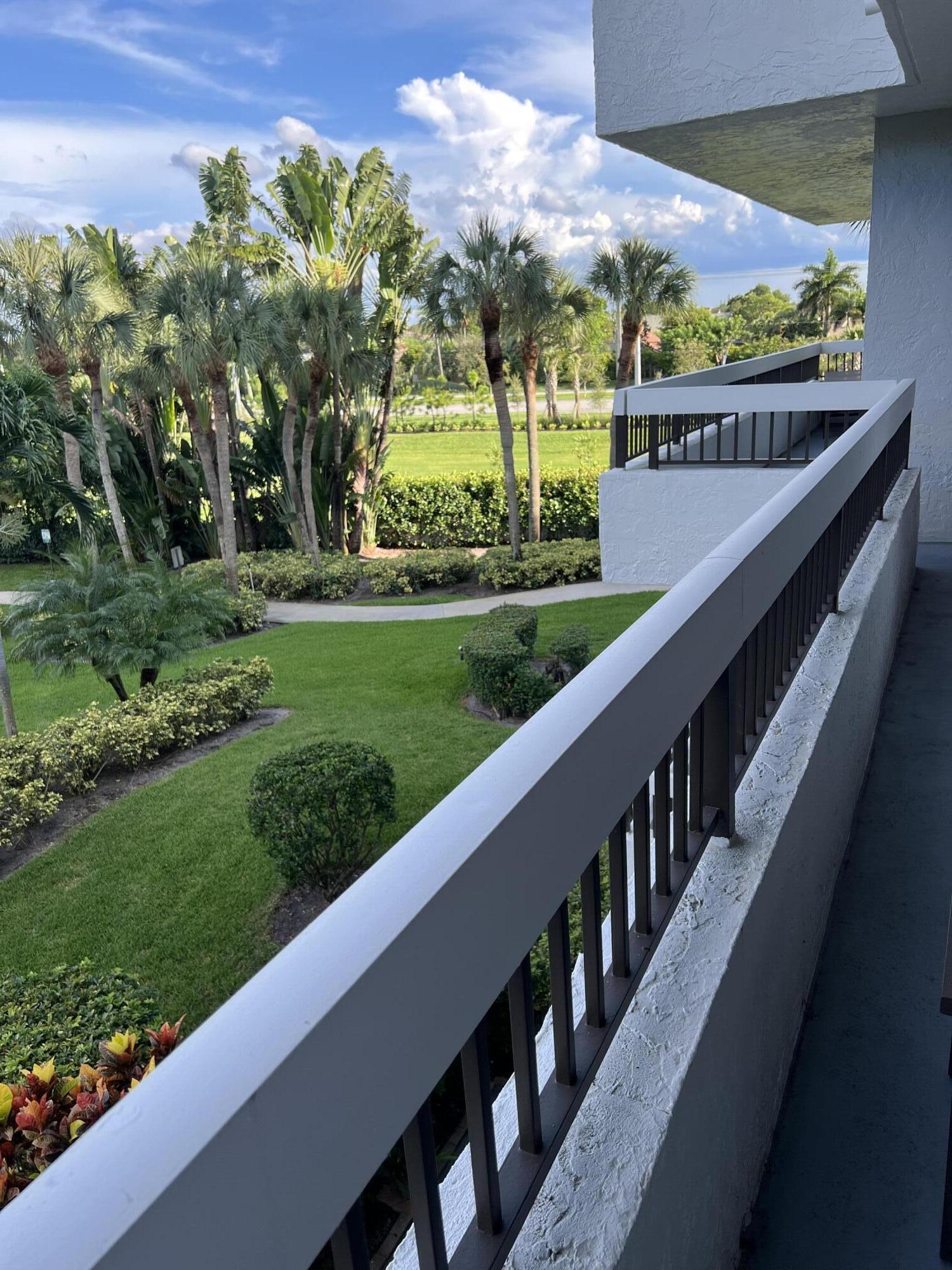23200 Camino Del Mar, Unit 303 Boca Raton, FL 33433 - Photo 4 of 33 a view of a garden from a balcony