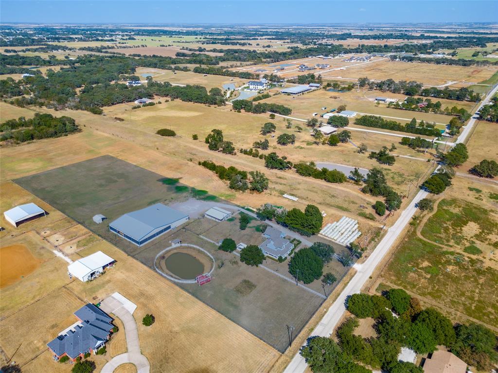 1601 East Blackjack Road East Pilot Point, TX 76258 - Photo 32 of 33 Expansive rural property featuring multiple structures, an arena, and a pond