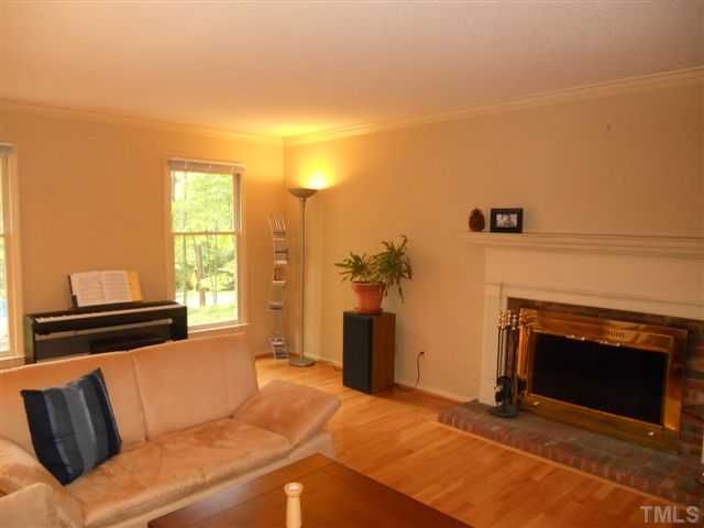 2440 Alpine Road Durham, NC 27707 - Photo 4 of 19 Fireplace w/brick hearth will have special appeal in wintertime!
