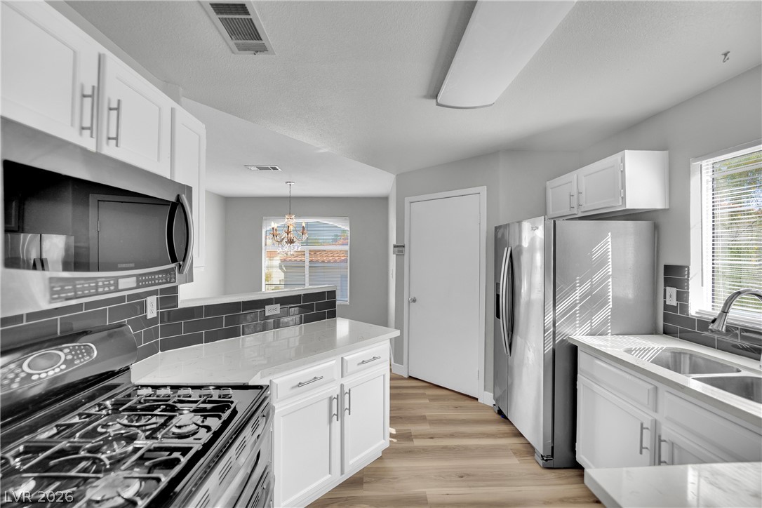 698 South Racetrack Road, Unit 1521 Henderson, NV 89015 - Photo 12 of 33 A well-appointed kitchen features stainless steel appliances, gleaming countertops, and stylish cabinetry.