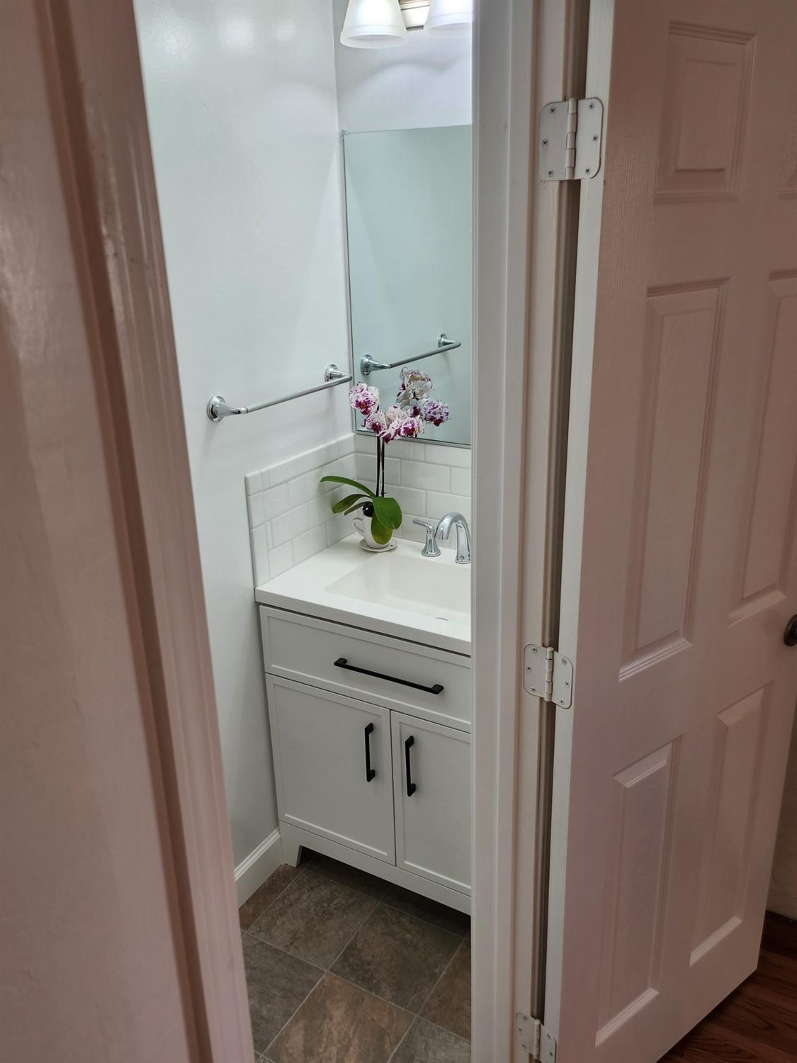 2011 11th Street Reedley, CA 93654 - Photo 9 of 17 a bathroom with a sink and a mirror