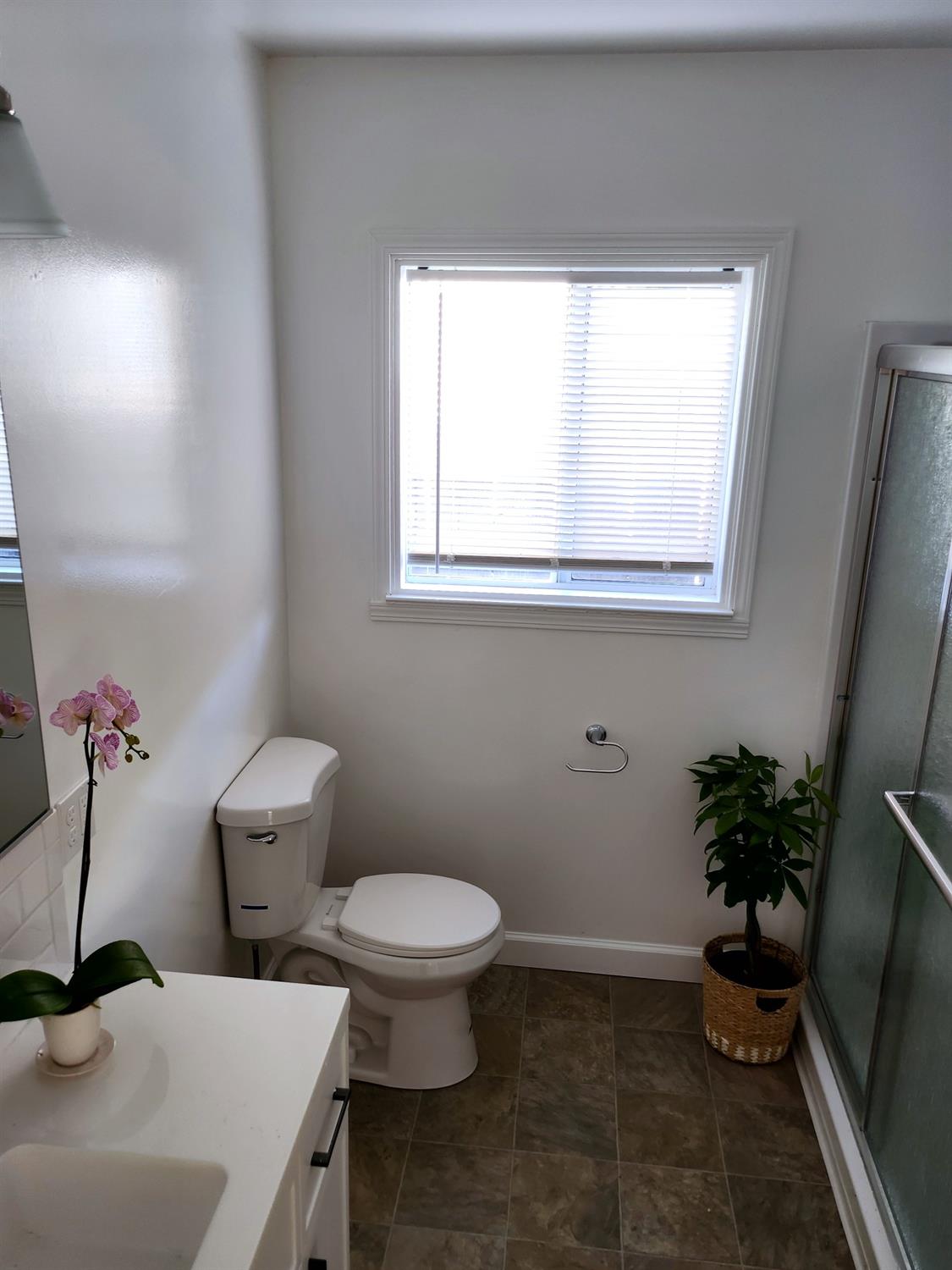 2011 11th Street Reedley, CA 93654 - Photo 10 of 17 a bathroom with a toilet and a sink
