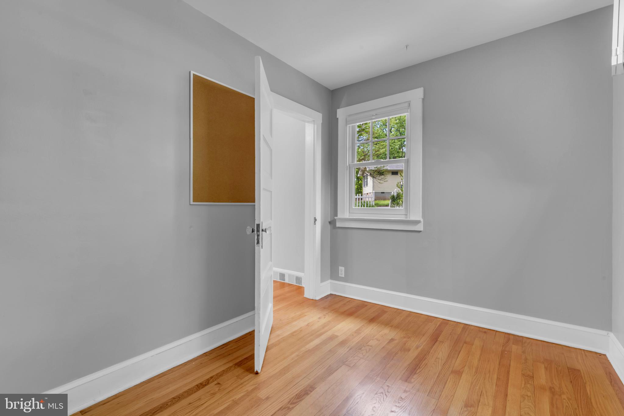155 Ridgeway Circle Arnold, MD 21012 - Photo 38 of 73 a view of an empty room with wooden floor and a window