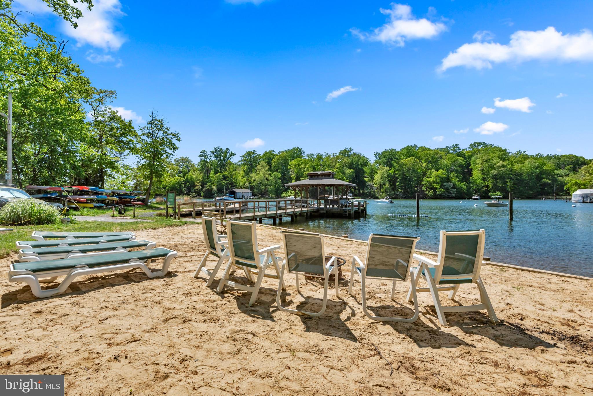 155 Ridgeway Circle Arnold, MD 21012 - Photo 58 of 73 a view of a lake with a table and chairs