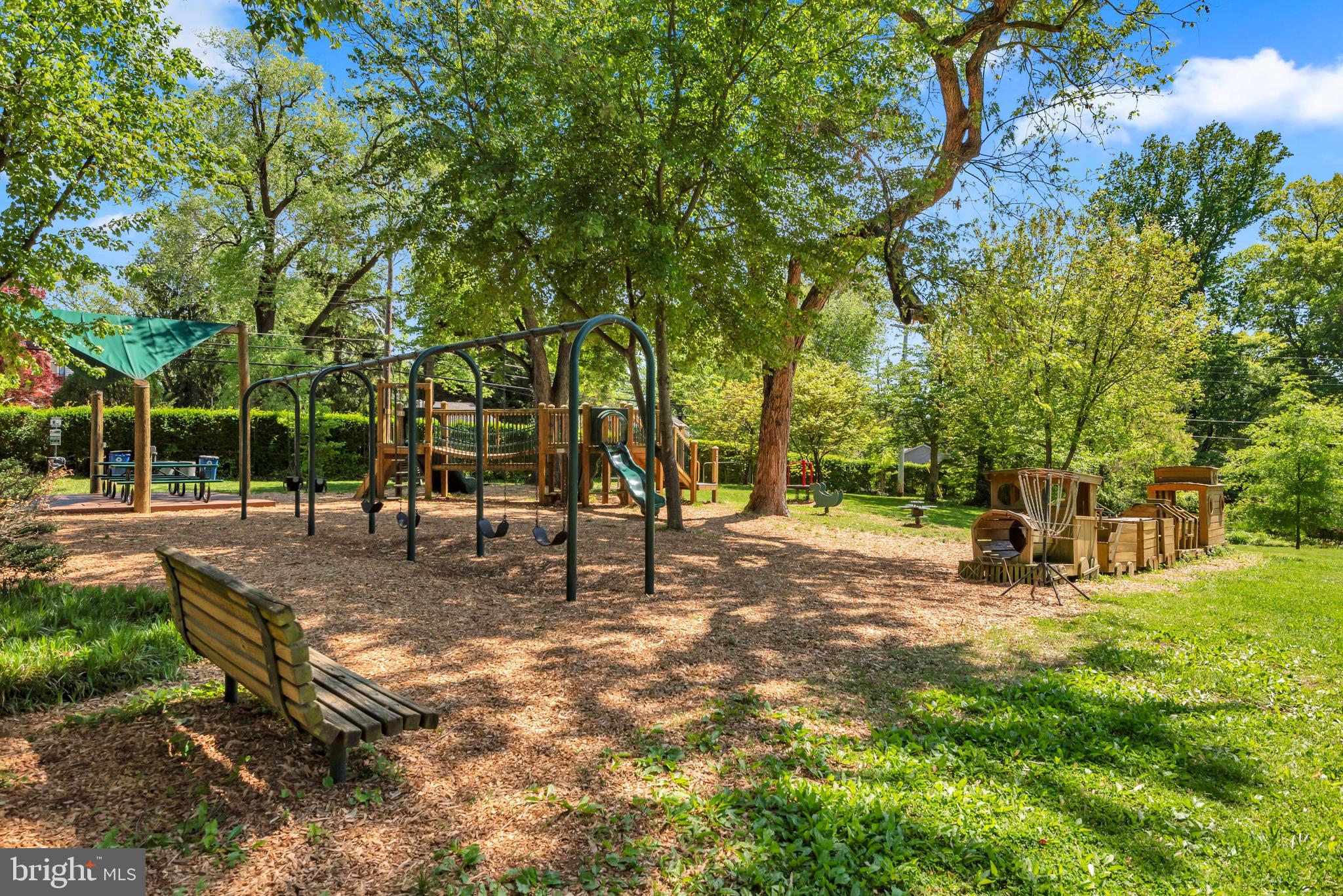 155 Ridgeway Circle Arnold, MD 21012 - Photo 63 of 73 a view of a park with swings and a bench