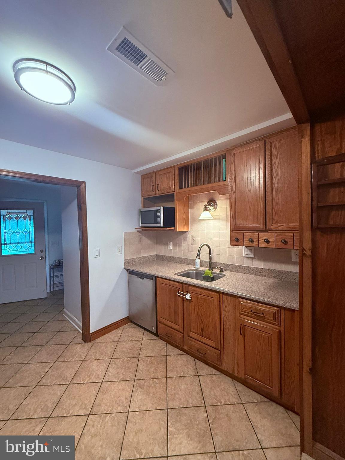 18318 Sharon Road Triangle, VA 22172 - Photo 13 of 27 a large kitchen with a sink and cabinets