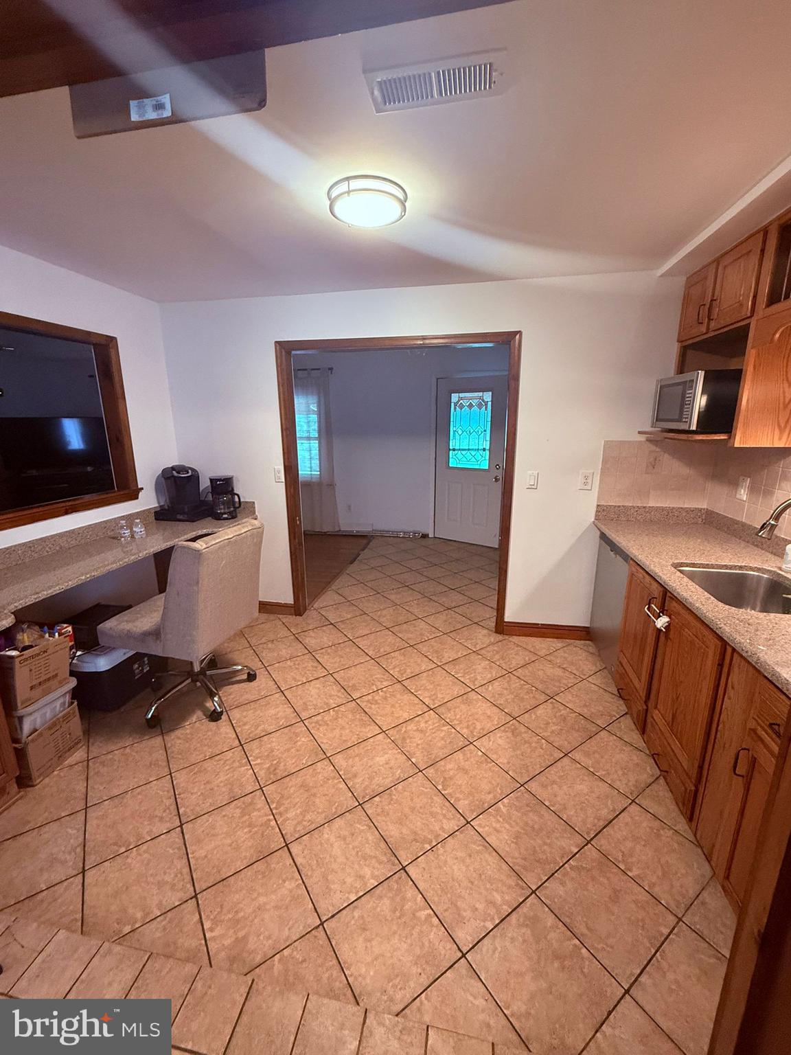 18318 Sharon Road Triangle, VA 22172 - Photo 15 of 27 a bedroom with a bed and a flat screen tv