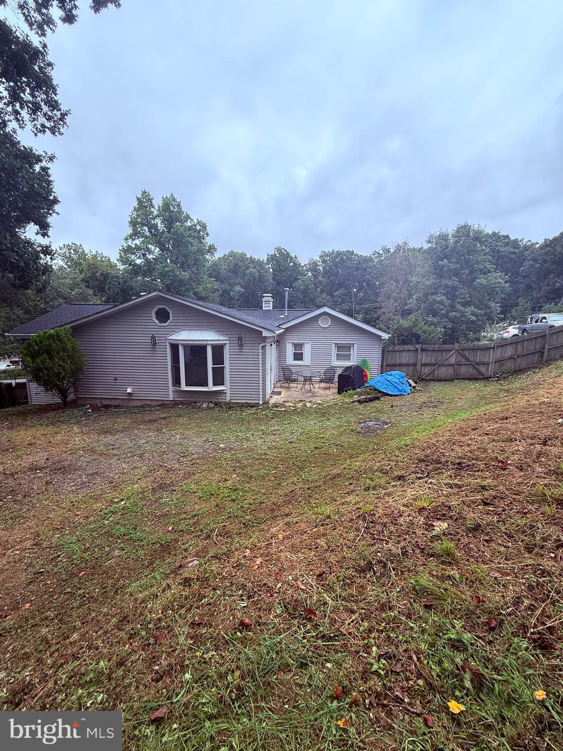 18318 Sharon Road Triangle, VA 22172 - Photo 24 of 27 a view of a house with a yard and sitting area