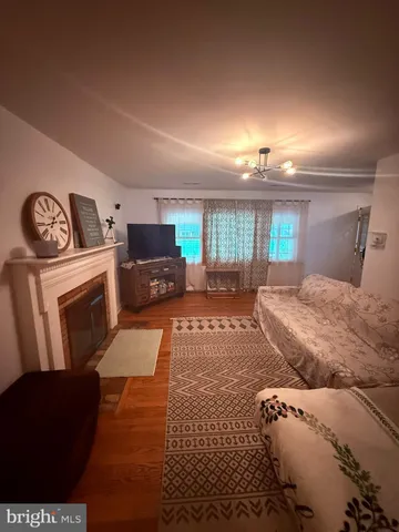 a spacious bedroom with a bed and a television