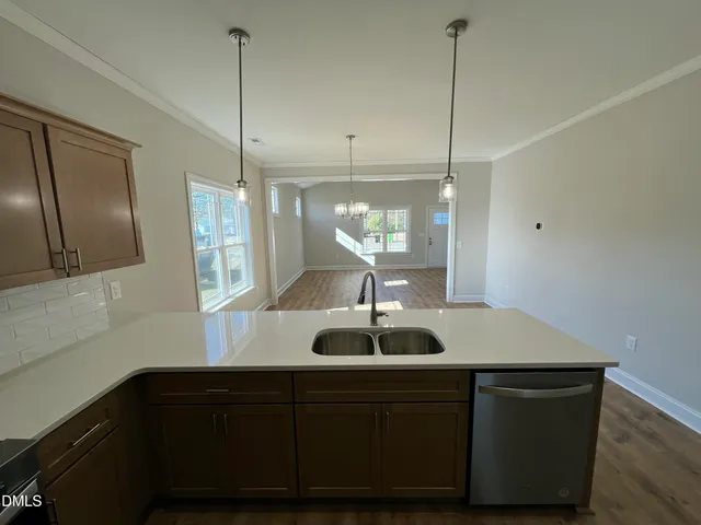 a kitchen with wooden cabinets and a sink